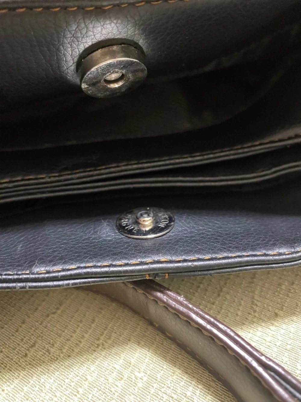 GUCCI black leather hobo handbag. Made in Italy with logo on the front.